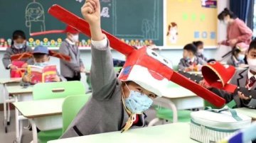 China: Students Are Returning To School With Isolation Hats
