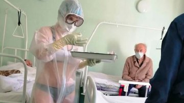 COVID-19: Russian Nurse Caught Wearing Only Lingerie Beneath See-Through PPE While Working In The Male Ward
