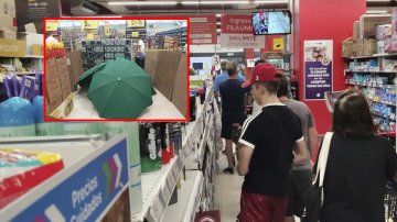 Manager Died At Work, Staff Covered His Dead Body By Umbrellas & Continued To Welcome Customers