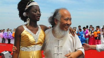 Old Chinese Painter Married 35 Years Younger African Girl, Spent $6 Million On Their Wedding