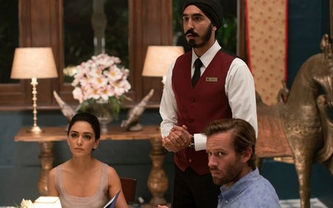 Armie Hammer, Dev Patel, and Nazanin Boniadi in one scene of the renowned movie Hotel Mumbai