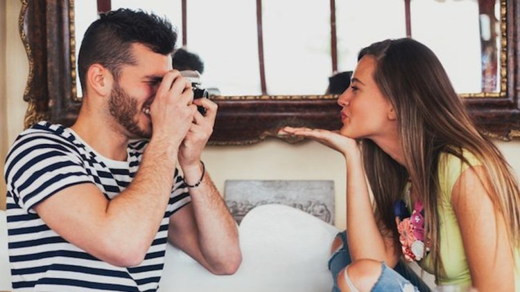 Playful Couple Blowing Kisses