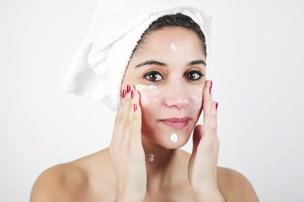 Portrait Young Woman Applying Moisturizer Her Face
