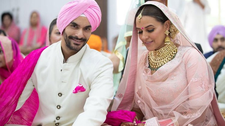 Neha Dhupia And Angad Bedi Paint Social Media Red