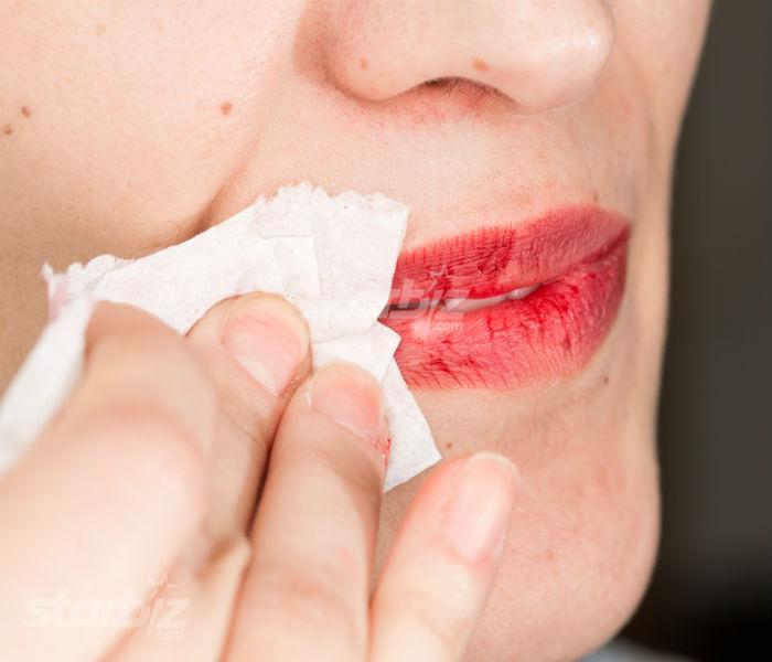 Applying lipstick on dry and flaky lips