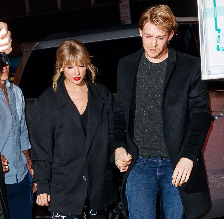 Taylor Swift and Joe Alwyn with a tight hand-in-hand