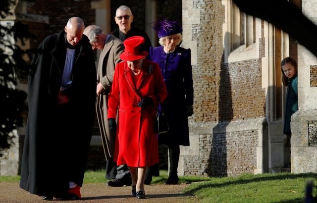 The Queen exited her car in the adorable red outfit for the 9 a.m. service