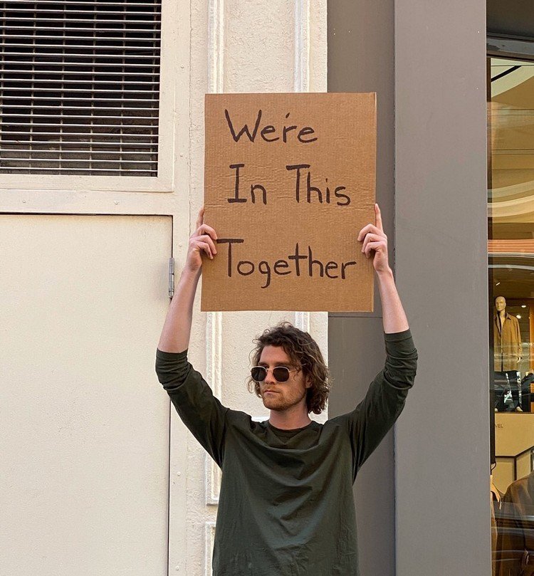 Dude With Sign Holds Cardboard To Raise Awareness On COVID19