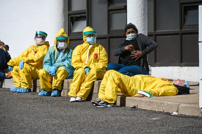 Health Care Professionals Take A Break Awaiting Pa