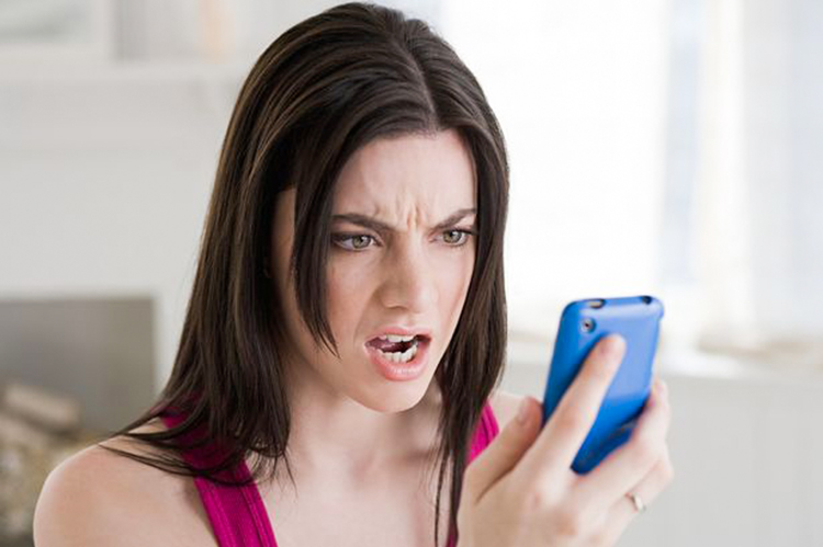 Angry Woman Looking At Phone