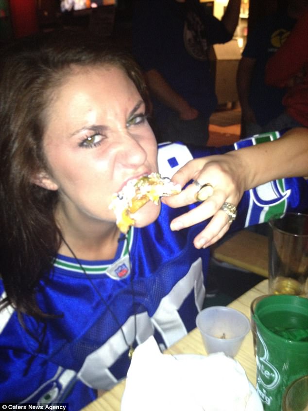 Woman Eats Food From Trash Bin Photo